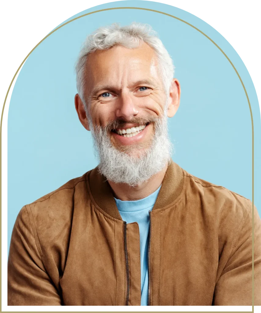 Smiling middle-aged man showcasing restored teeth with dental implants Dubbo treatment.