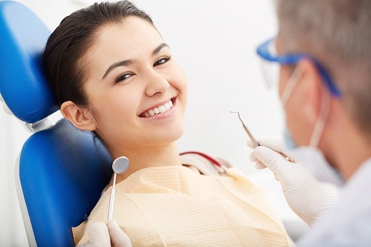 A professional dental consultation in Dubbo discussing Invisalign clear aligner options for a patient at Advanced Dental Care.