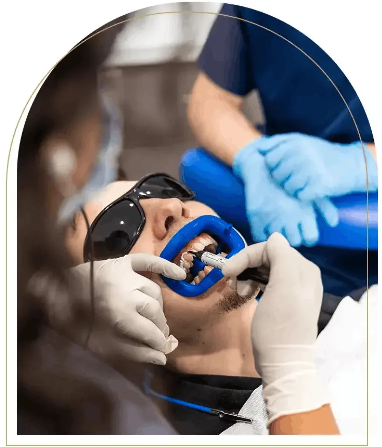 Dental professional caring for patient's oral health