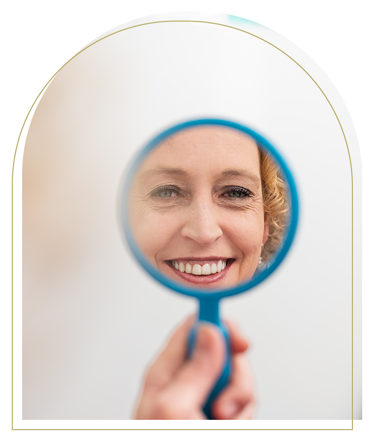 3. Happy patient checking smile after composite veneers treatment