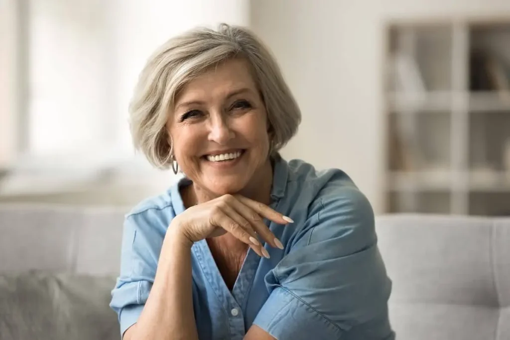 Older woman smiling confidently after successful dental implant recovery in Dubbo.